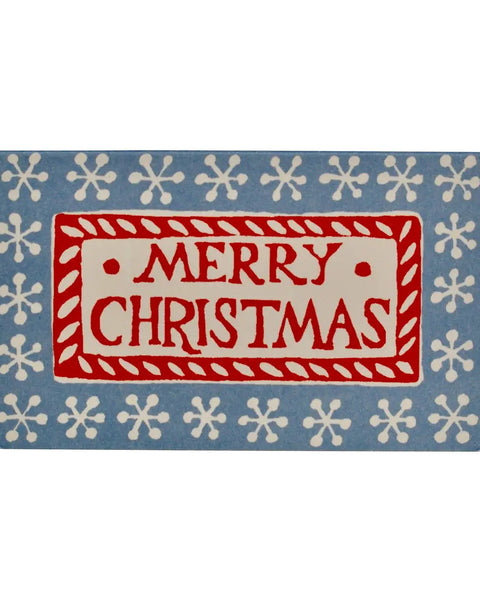 A square Christmas doormat with a blue background, white snowflake border, and a central red and cream rectangle that reads “MERRY CHRISTMAS.”.