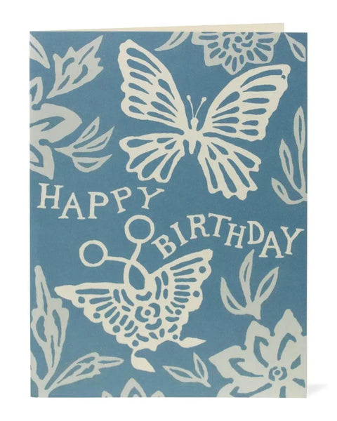 Blue birthday card with white butterfly designs and 'Happy Birthday' text